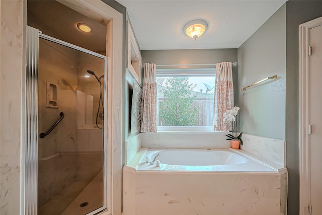 full bathroom with a garden tub and a stall shower