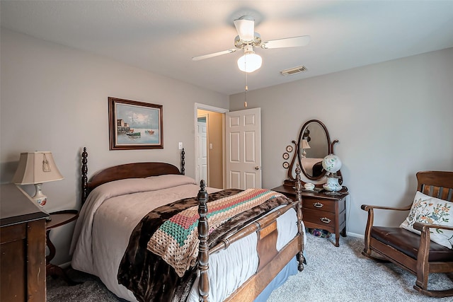 carpeted bedroom featuring baseboards, visible vents, and ceiling fan