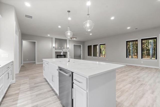 kitchen with recessed lighting, visible vents, stainless steel dishwasher, and open floor plan