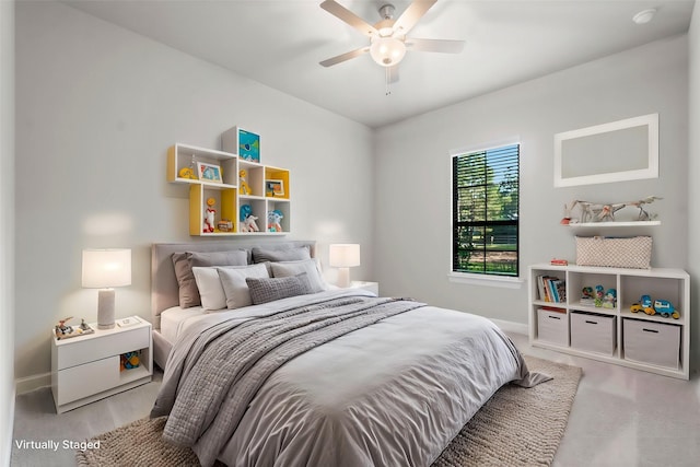 bedroom with baseboards and a ceiling fan