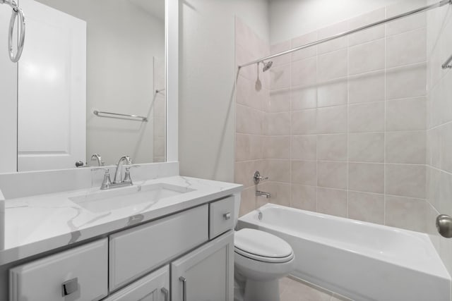 bathroom featuring tile patterned flooring, vanity, toilet, and shower / bathtub combination