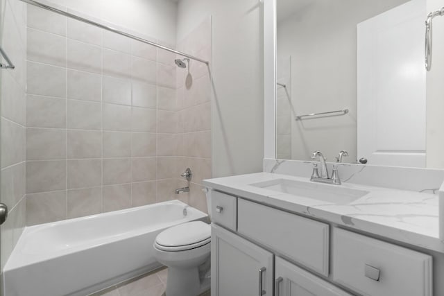 bathroom featuring shower / bath combination, toilet, and vanity