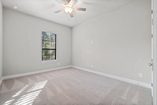 unfurnished room featuring ceiling fan, baseboards, and light carpet