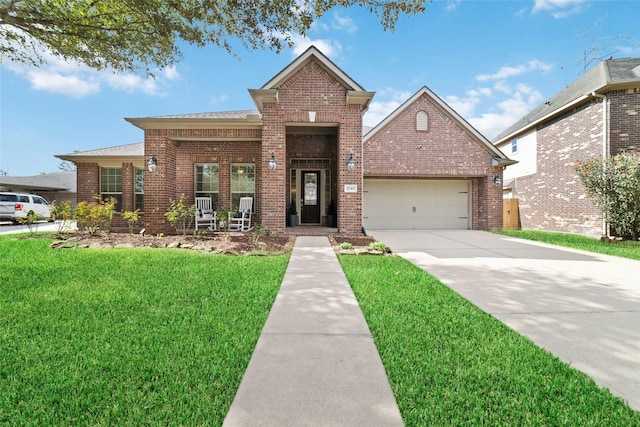 traditional home featuring a front lawn, a garage, and brick siding