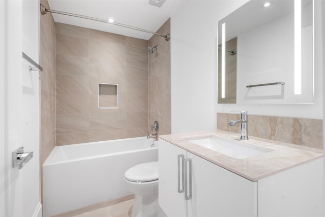 full bath with visible vents, vanity, toilet, and shower / bathtub combination