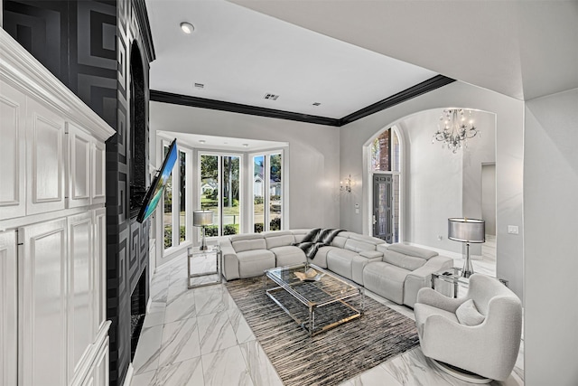 living room featuring visible vents, a notable chandelier, marble finish floor, and crown molding