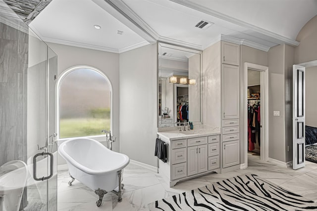 bathroom with visible vents, marble finish floor, a freestanding tub, and ornamental molding