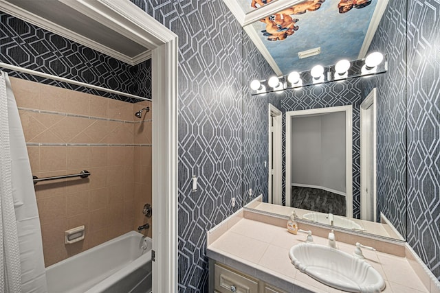 bathroom featuring shower / tub combo with curtain, vanity, and wallpapered walls