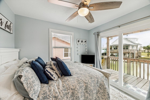 bedroom featuring access to outside and ceiling fan