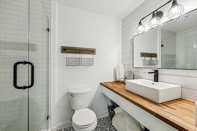 16715 Montego Way, Jamaica Beach, TX 77554 - bathroom with a stall shower, baseboards, a sink, and toilet