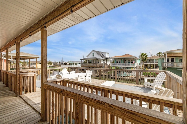 wooden deck featuring a residential view