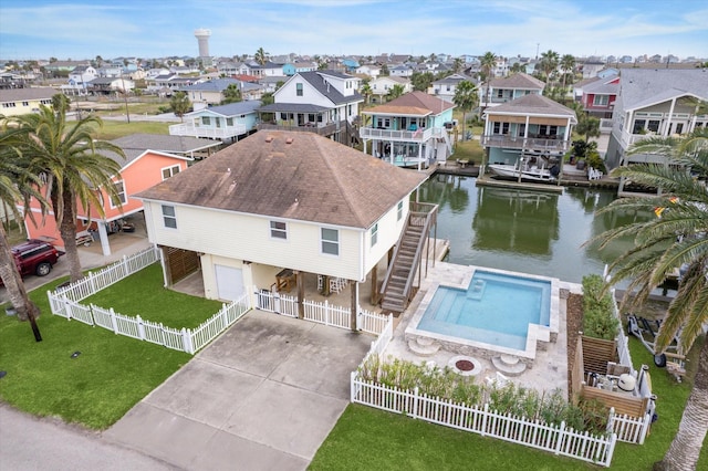 aerial view with a residential view and a water view