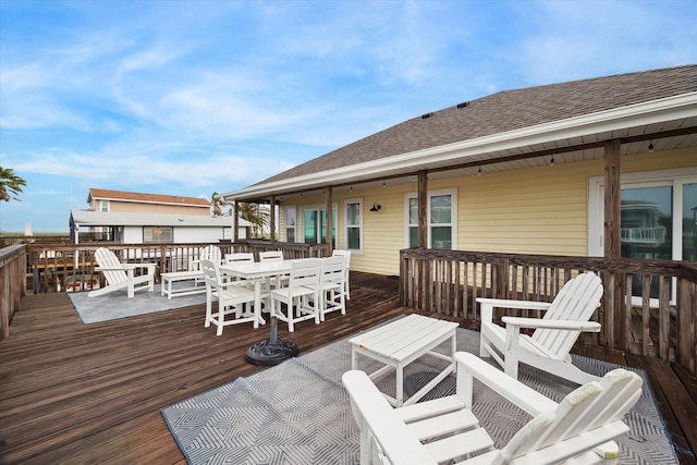 16715 Montego Way, Jamaica Beach, TX 77554 - wooden terrace with outdoor dining space