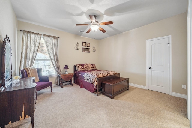 carpeted bedroom featuring visible vents, ceiling fan, and baseboards