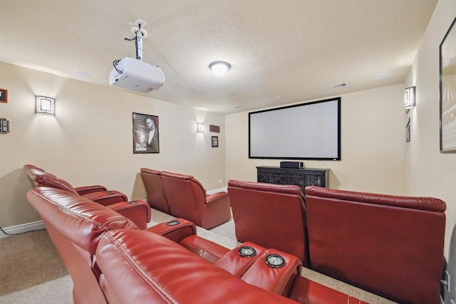 carpeted home theater with baseboards, visible vents, and a textured ceiling