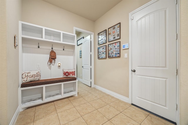 mudroom featuring tile patterned flooring and baseboards