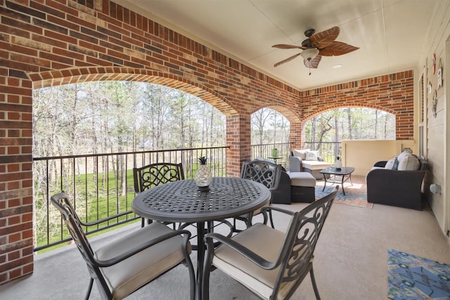 view of patio / terrace with an outdoor hangout area, outdoor dining space, and a ceiling fan