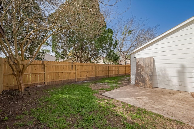 view of yard with a patio and a fenced backyard