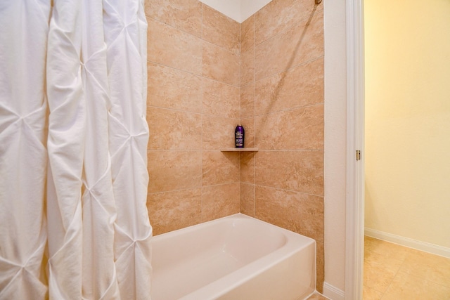 bathroom featuring tile patterned flooring and baseboards