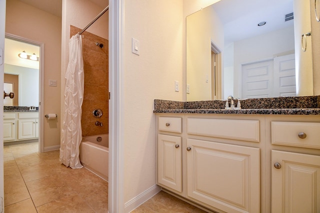 bathroom featuring vanity, visible vents, baseboards, and shower / tub combo with curtain