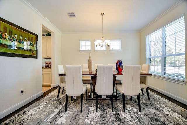 dining space featuring visible vents, a notable chandelier, a healthy amount of sunlight, and ornamental molding