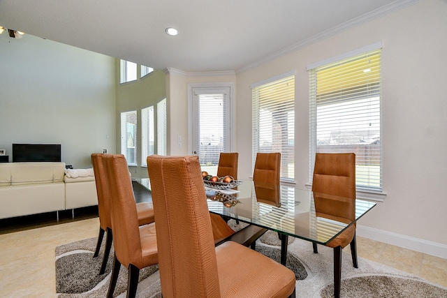 tiled dining area with recessed lighting, baseboards, and crown molding