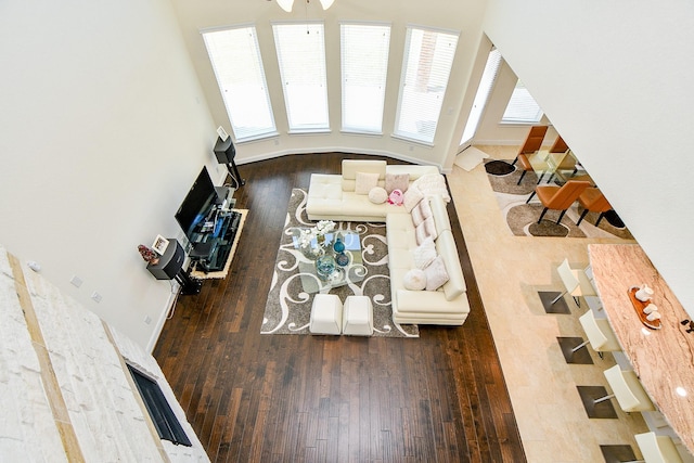 living room featuring baseboards and hardwood / wood-style floors