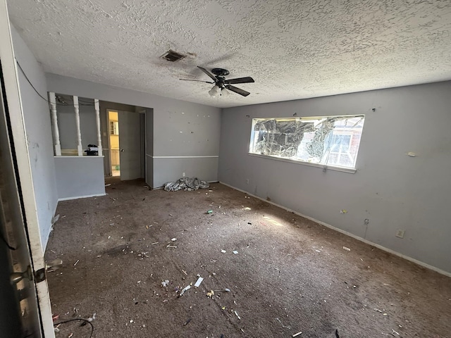 unfurnished bedroom with visible vents and a textured ceiling