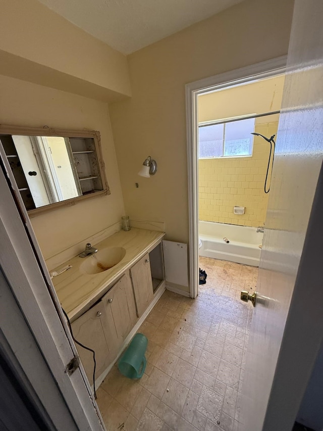 full bathroom featuring vanity and  shower combination