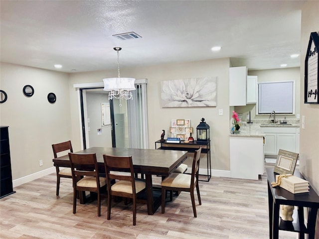 806 Moody Ave, League City, TX 77573 - dining room with light wood-type flooring, visible vents, and baseboards