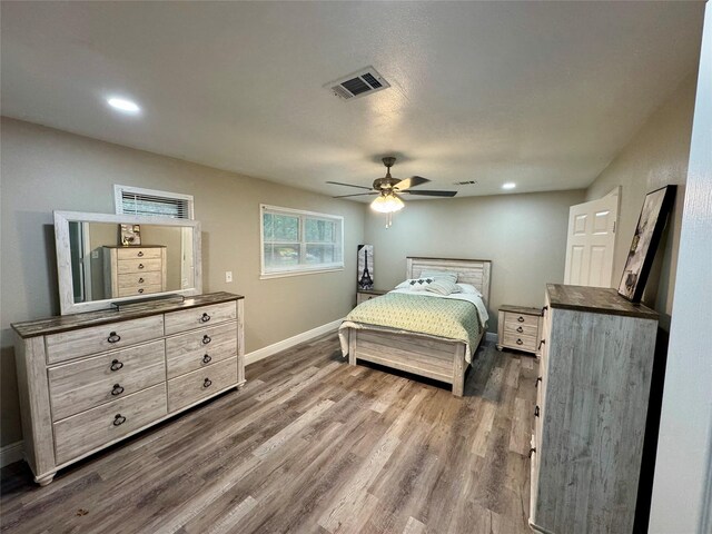 806 Moody Ave, League City, TX 77573 - bedroom featuring visible vents, dark wood finished floors, recessed lighting, baseboards, and ceiling fan