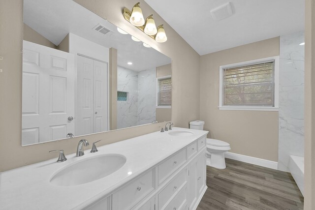 806 Moody Ave, League City, TX 77573 - full bathroom with toilet, wood finished floors, visible vents, and a sink