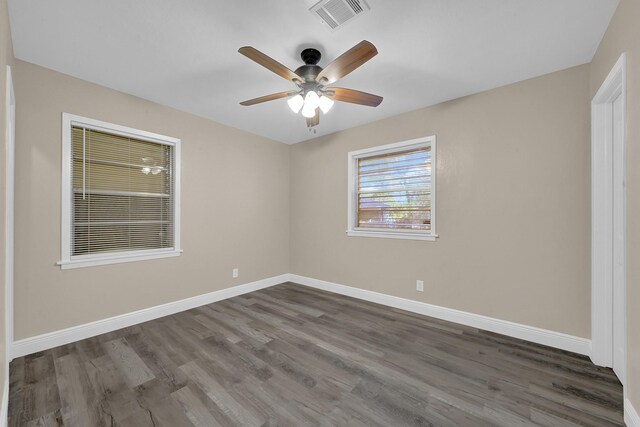 806 Moody Ave, League City, TX 77573 - empty room featuring visible vents, baseboards, wood finished floors, and a ceiling fan
