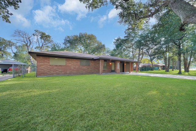 806 Moody Ave, League City, TX 77573 - view of front facade with brick siding, driveway, a front lawn, and fence