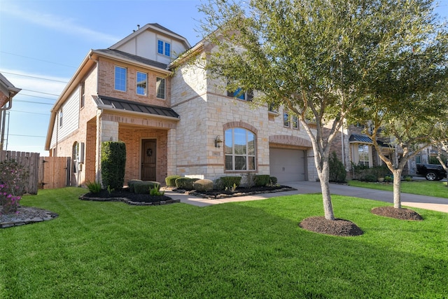 view of front of home with brick siding, a front lawn, fence, driveway, and a standing seam roof