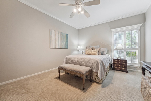 carpeted bedroom featuring baseboards, ceiling fan, and crown molding