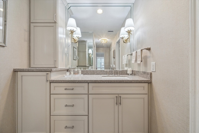 bathroom with vanity and visible vents