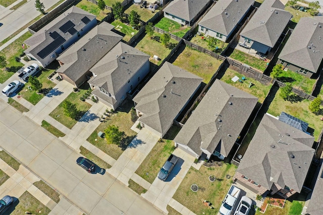 birds eye view of property with a residential view