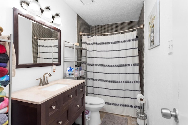 bathroom featuring toilet, a textured ceiling, vanity, and a shower with curtain