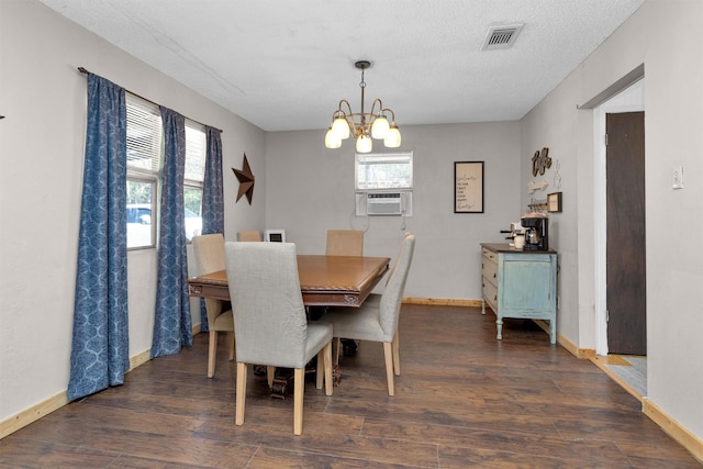 dining room featuring a chandelier, plenty of natural light, baseboards, and dark wood-style flooring