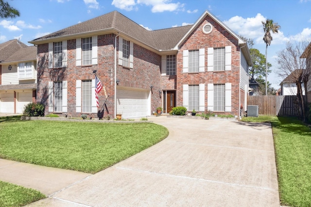1107 Chesterwood Dr, Pearland, TX 77581 - view of front of property with driveway, a garage, brick siding, and a shingled roof