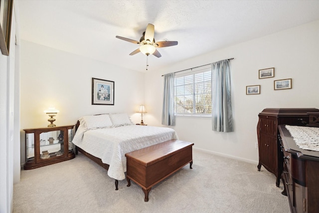 1107 Chesterwood Dr, Pearland, TX 77581 - bedroom featuring light carpet, baseboards, and ceiling fan