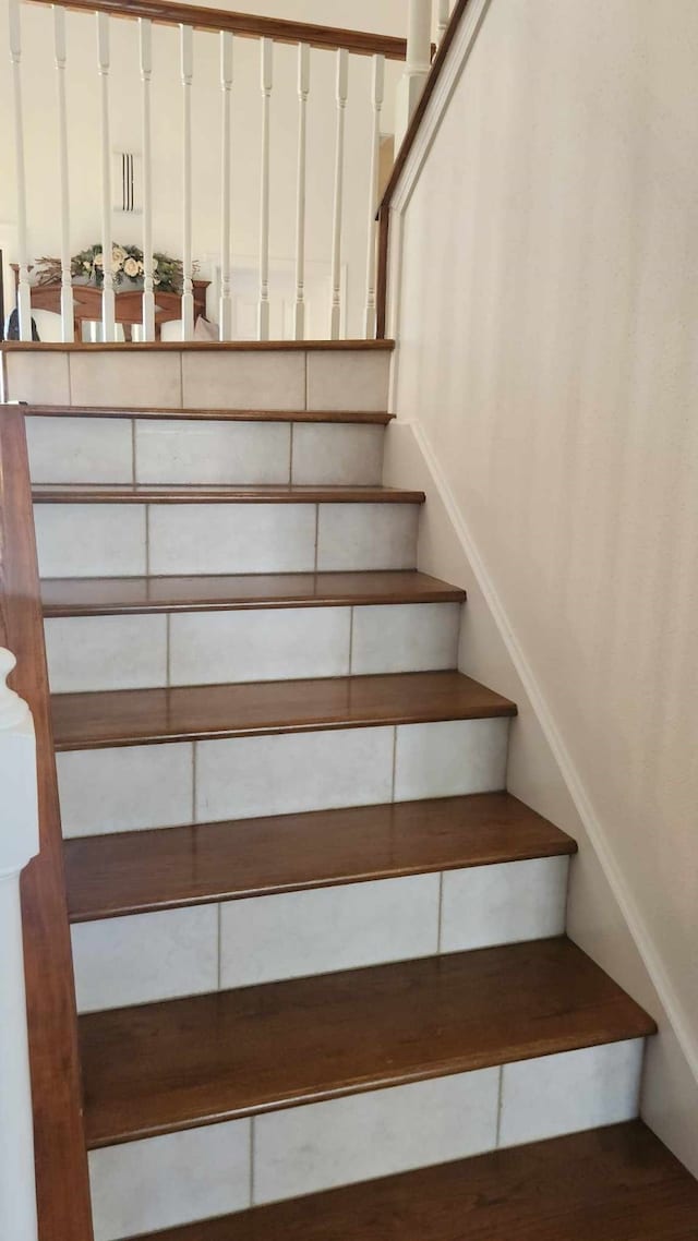 1107 Chesterwood Dr, Pearland, TX 77581 - stairs with wood finished floors