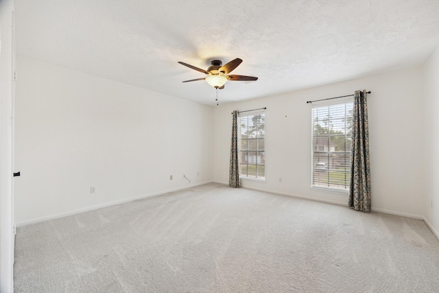 1107 Chesterwood Dr, Pearland, TX 77581 - unfurnished room featuring a ceiling fan, light colored carpet, baseboards, and a textured ceiling