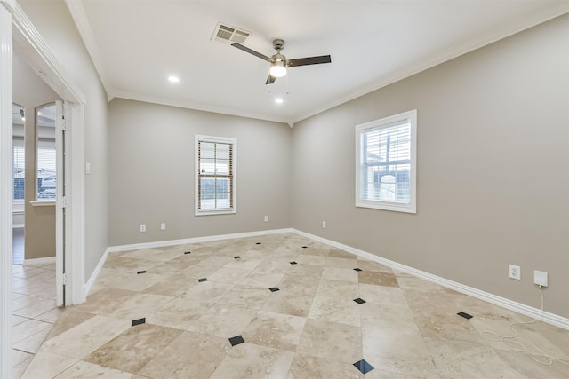 spare room with a wealth of natural light, visible vents, baseboards, and ornamental molding