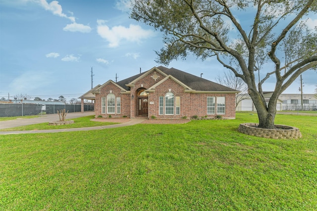 ranch-style house with brick siding, a front lawn, and roof with shingles