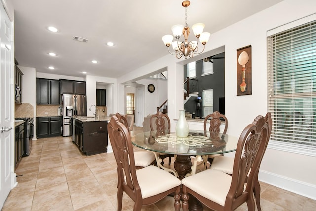 dining space featuring visible vents, a notable chandelier, recessed lighting, stairway, and light tile patterned floors