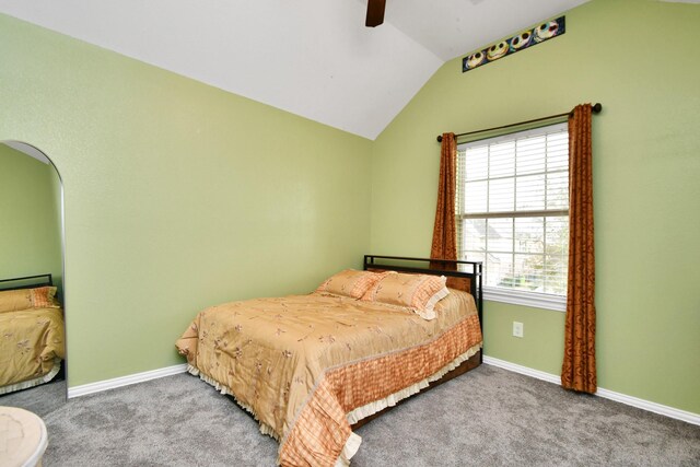 bedroom featuring vaulted ceiling, carpet flooring, baseboards, and ceiling fan