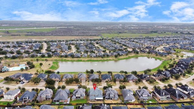 aerial view featuring a residential view and a water view