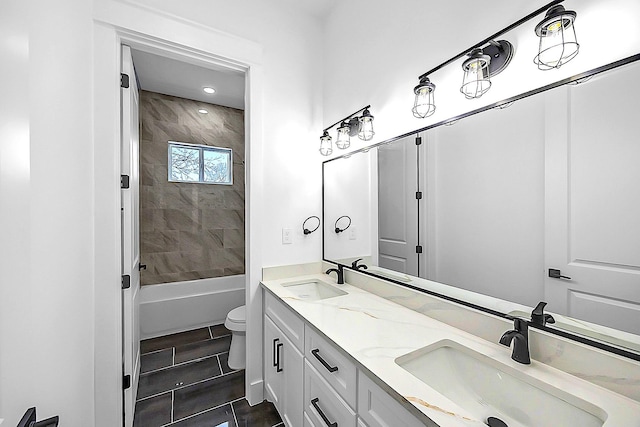 6716 Ave R, Houston, TX 77011 - bathroom featuring double vanity, toilet, bathtub / shower combination, tile patterned floors, and recessed lighting